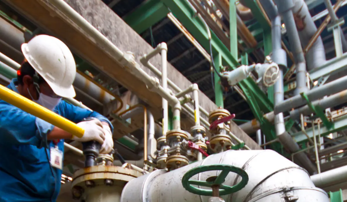 Engineer operating machinery in a factory
