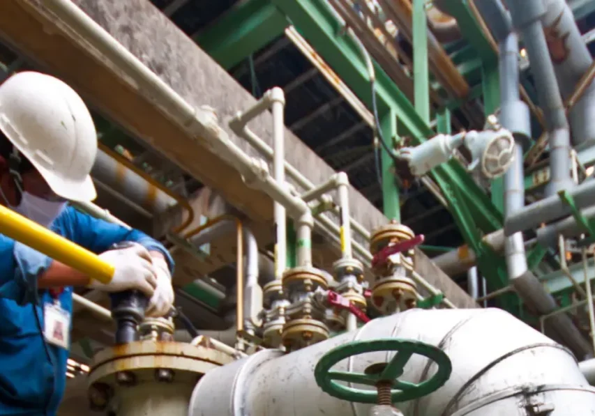 Engineer operating machinery in a factory